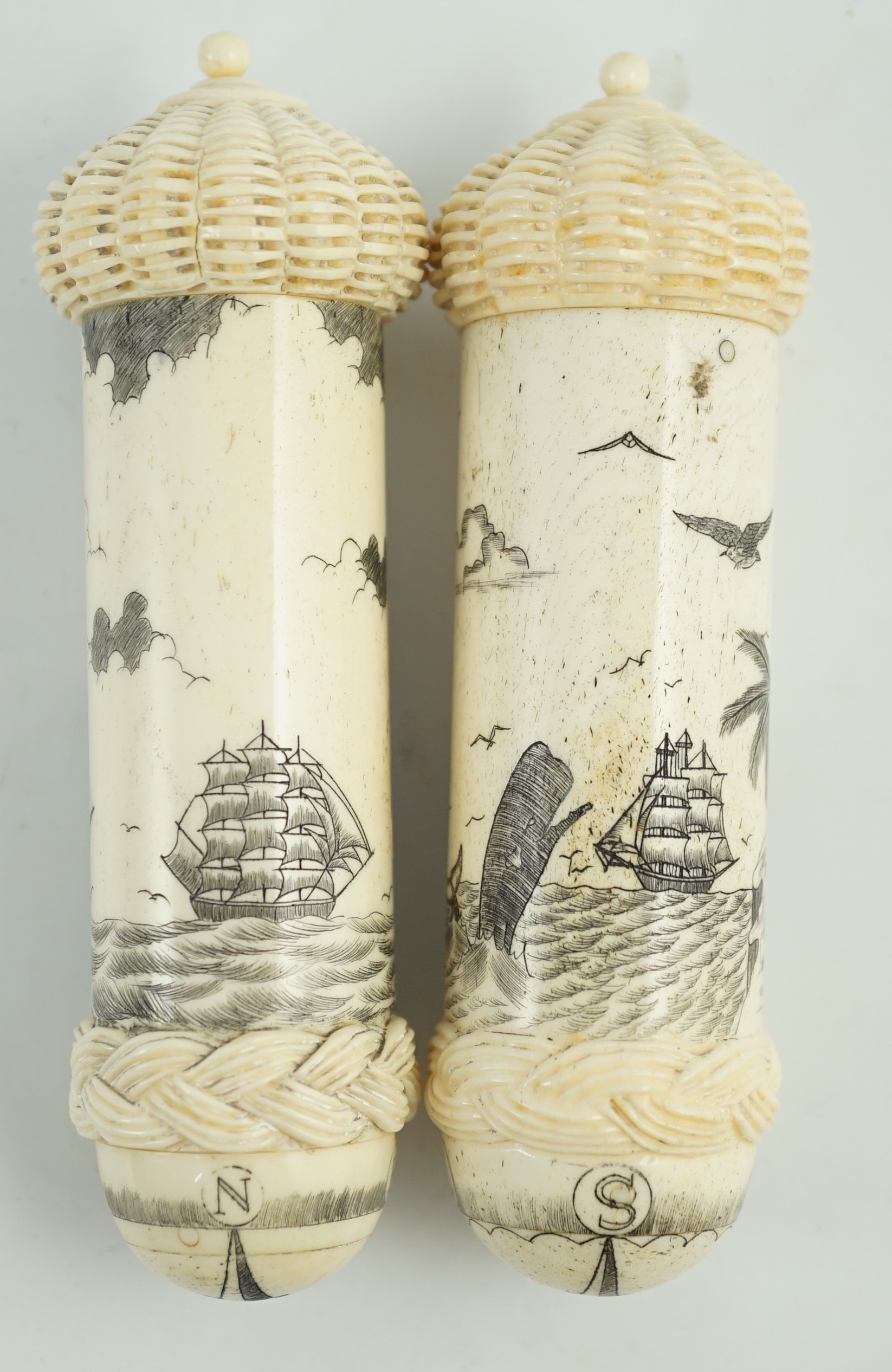 Two bone scrimshaw needle cases, 12cms high